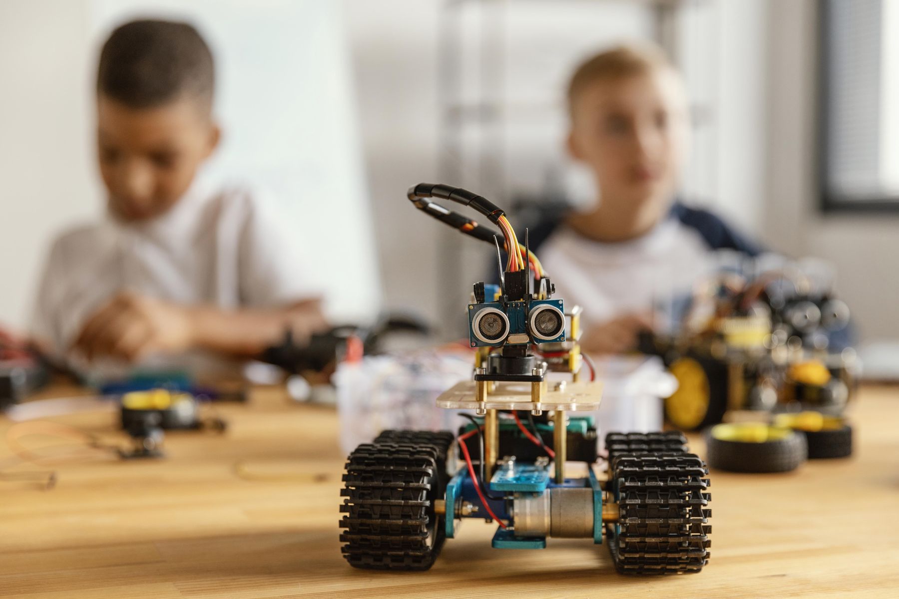 Students building robots in a Codegineers robotics class